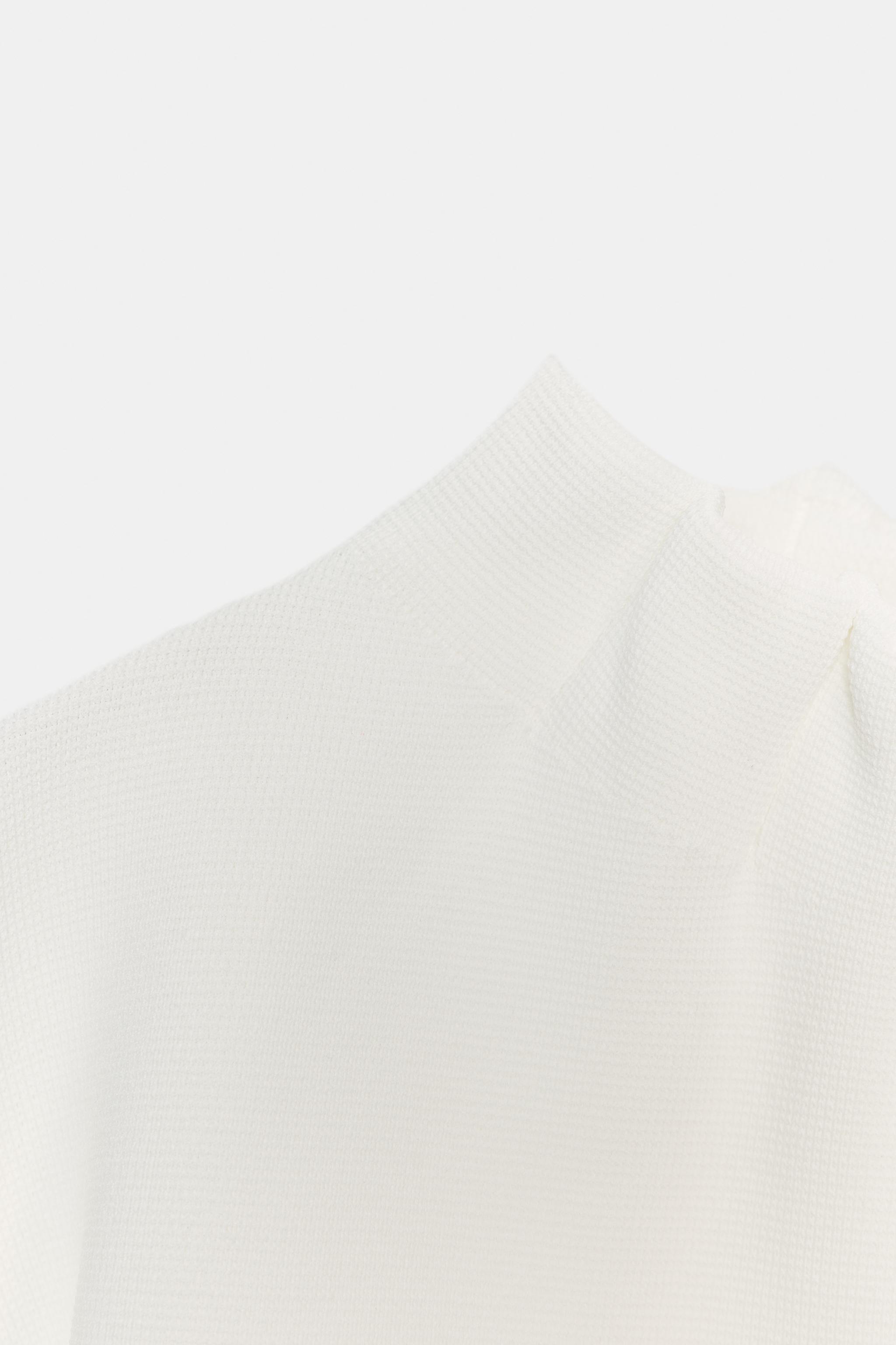 TOP EN MAILLE À FRONCES